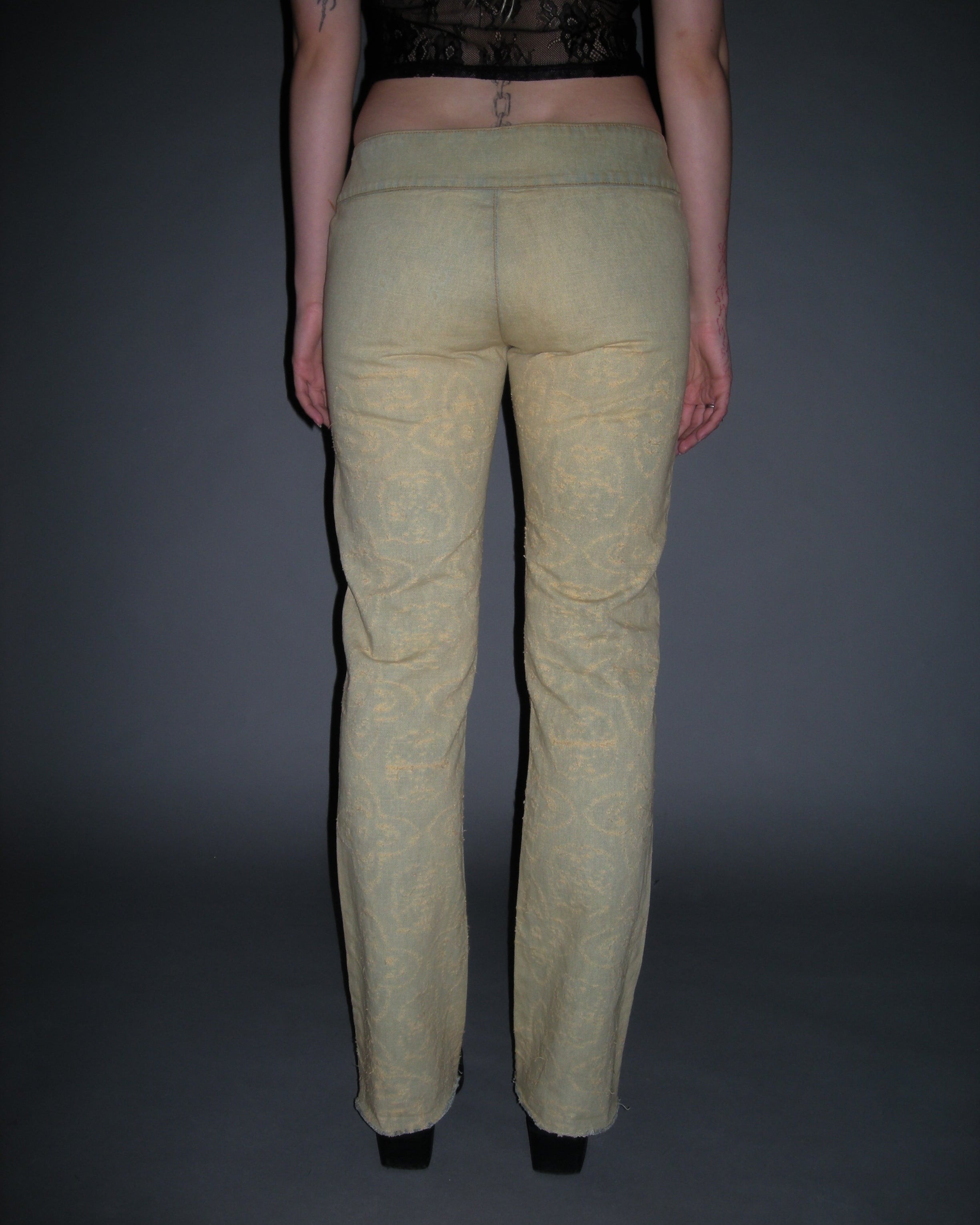 low waisted distressed medallion print flared jeans